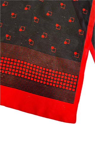 Long vintage 1970s scarf in semi-sheer black acetate with a red border and small red square print.