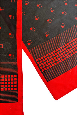 Long vintage 1970s scarf in semi-sheer black acetate with a red border and small red square print.