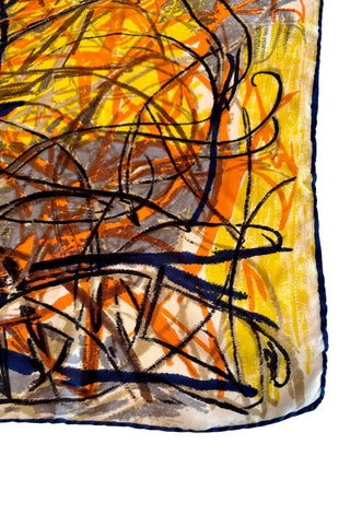 Vintage silk scarf with rolled edges, with an abstract “scribble” pattern in shades of navy blue, orange, yellow and brown. The soft and supple silk drapes beautifully. 