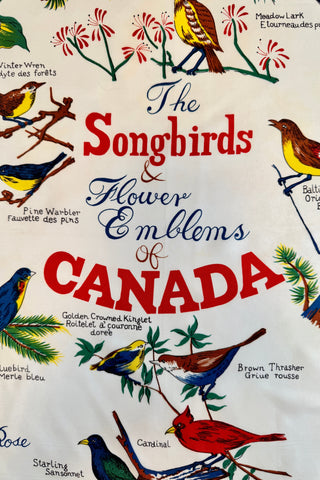 Lovely vintage souvenir scarf featuring charming illustrations of the songbirds and flower emblems of the provinces of Canada.