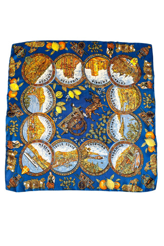 Richly detailed vintage souvenir scarf from Sicily, featuring illustrations of famous sights of several Sicilian cities, along with botanical illustrations and depictions of traditional Sicilian dress and design.