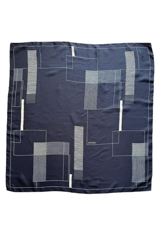 Vintage silk scarf by Mondi in deep navy blue with white geometric print of interlocking, overlapping squares with stripes and rectangles.