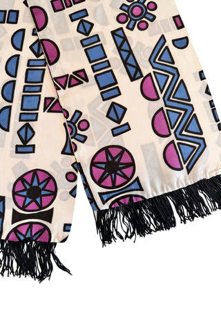 Long white vintage evening scarf with black fringed ends, featuring a collection of bold geometric shapes in shades of pigeon blue, plum purple and black. 