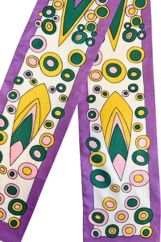 Bright, fun polka dot psychedelic print long scarf with a purple border and pattern in shades of bottle green, baby pink, and sunshine yellow.