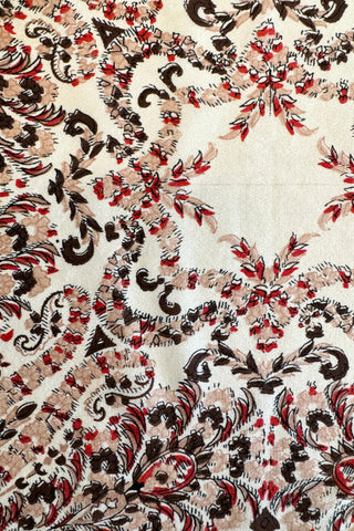 1930s silk handkerchief with a light beige background, foreground intricately printed in a floral garland print of burgundy, brown and black.