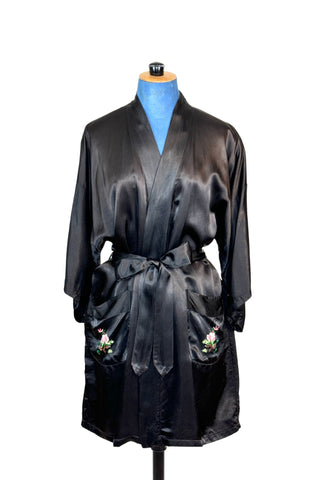 Vintage kimono-style 1950s robe in silky black rayon, embroidered with flowers on each pocket and a charming yellow bird and floral branch on the back.