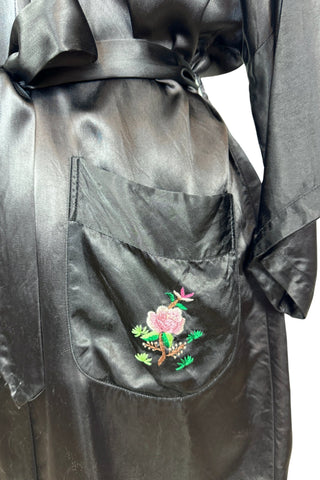 Vintage kimono-style 1950s robe in silky black rayon, embroidered with flowers on each pocket and a charming yellow bird and floral branch on the back.