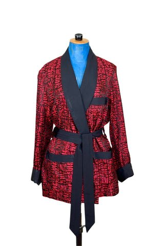 Suave vintage 1970s smoking jacket by Majestic in red and black patterned acetate (the collar, cuffs, and belt seem to be rayon faille, although the tag says 100% acetate - this may not include the trim). Slip into this beauty after a long day and let the mellowing out begin. 