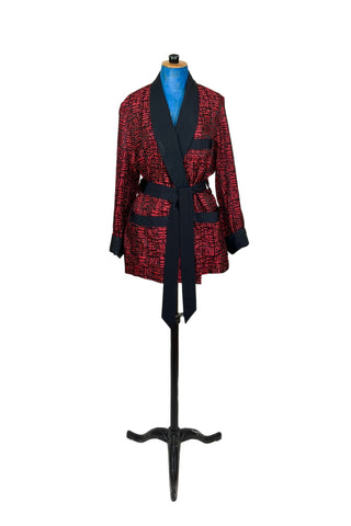 Suave vintage 1970s smoking jacket by Majestic in red and black patterned acetate (the collar, cuffs, and belt seem to be rayon faille, although the tag says 100% acetate - this may not include the trim). Slip into this beauty after a long day and let the mellowing out begin. 