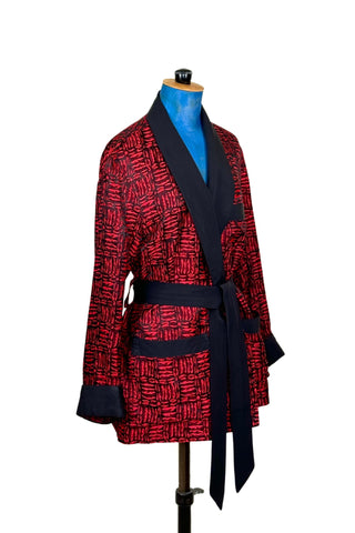 Suave vintage 1970s smoking jacket by Majestic in red and black patterned acetate (the collar, cuffs, and belt seem to be rayon faille, although the tag says 100% acetate - this may not include the trim). Slip into this beauty after a long day and let the mellowing out begin. 