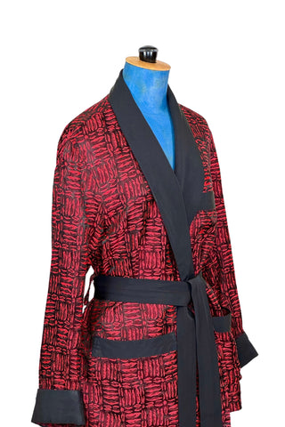 Suave vintage 1970s smoking jacket by Majestic in red and black patterned acetate (the collar, cuffs, and belt seem to be rayon faille, although the tag says 100% acetate - this may not include the trim). Slip into this beauty after a long day and let the mellowing out begin. 