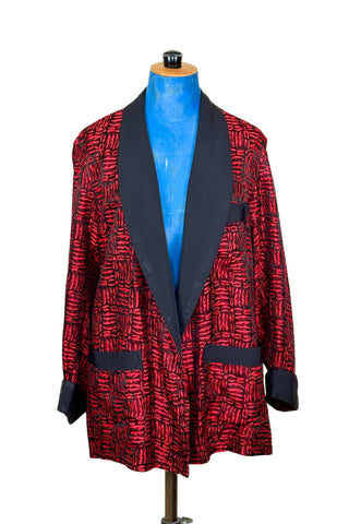 Suave vintage 1970s smoking jacket by Majestic in red and black patterned acetate (the collar, cuffs, and belt seem to be rayon faille, although the tag says 100% acetate - this may not include the trim). Slip into this beauty after a long day and let the mellowing out begin. 