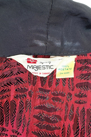 Suave vintage 1970s smoking jacket by Majestic in red and black patterned acetate (the collar, cuffs, and belt seem to be rayon faille, although the tag says 100% acetate - this may not include the trim). Slip into this beauty after a long day and let the mellowing out begin. 