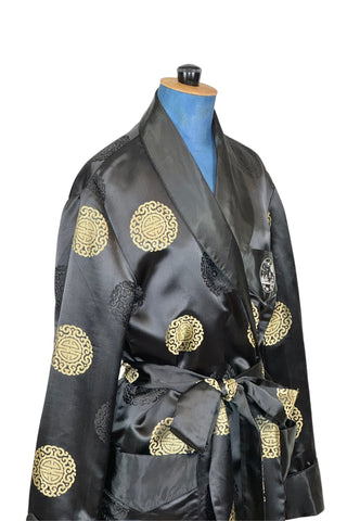 Rich, heavy rayon vintage 1940s robe of black and gold Chinese brocade. The brocade design features intricate gold and black medallions. The chest pocket is embroidered with a charming landscape scene. Fully lined in soft black rayon. Marked size 42. 