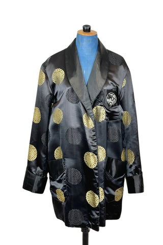 Rich, heavy rayon vintage 1940s robe of black and gold Chinese brocade. The brocade design features intricate gold and black medallions. The chest pocket is embroidered with a charming landscape scene. Fully lined in soft black rayon. Marked size 42. 