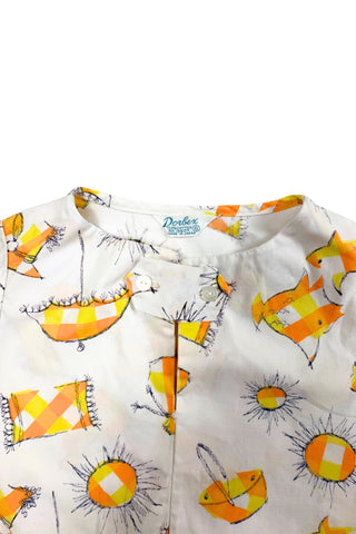 Lovely little vintage 1950s children’s top with beach-themed novelty print including fish, sand buckets, hats, towels, and shining suns. Perfect for a bright summer day at the beach.