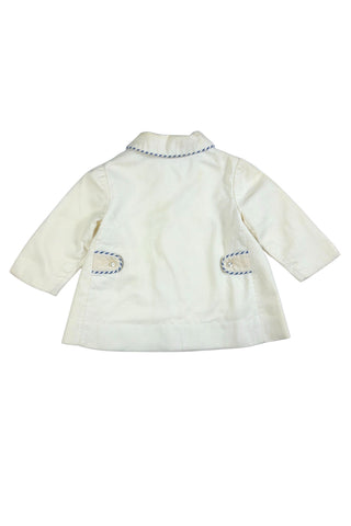 Sweet little vintage 1960s children’s coat in cream wool, with striped blue and white piping along the Peter Pan collar and decorative pocket flaps. The left pocket is embroidered with a Moroccan Berber motif.