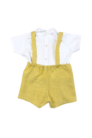 Vintage toddler’s two piece set of embroidered yellow overalls and crisp white blouse. The bib of the overalls is decorated with red, green, and yellow rickrack trim, and an embroidered scene with two tiny people wearing lederhosen outfits. The overalls have adjustable straps with two sets of buttons for two length options. The back of the waist is elasticized. The white blouse has a small pointed collar, a decorative folded faux-placket down the front, and closes with three buttons in the back.