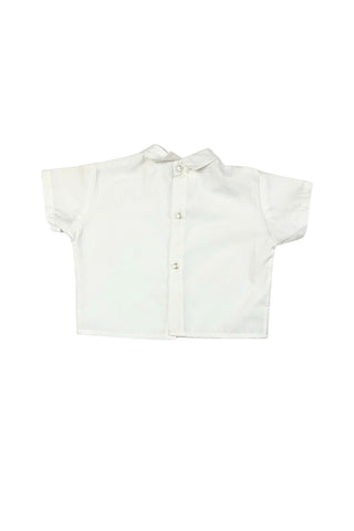 Vintage toddler’s two piece set of embroidered yellow overalls and crisp white blouse. The bib of the overalls is decorated with red, green, and yellow rickrack trim, and an embroidered scene with two tiny people wearing lederhosen outfits. The overalls have adjustable straps with two sets of buttons for two length options. The back of the waist is elasticized. The white blouse has a small pointed collar, a decorative folded faux-placket down the front, and closes with three buttons in the back.