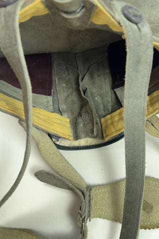Vintage 1960s boys’ lederhosen in grey leather suede, with white scalloped suede trim, black leather accents and red suede piping.
The straps have metal buckle closures at the chest, and attach to the shorts with buttons (the shorts may be worn without straps). The front of the shorts has a flap that closes with two buttons at the waist.
In good vintage condition, with normal wear to the suede consistent with age. The inside of the front panel has a faux leather (vinyl) lining, where the vinyl has...