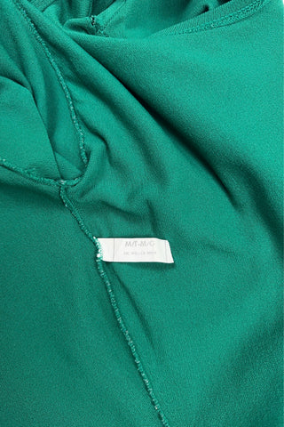 Vintage 1970s Mondor leotard in emerald green. Features a round neckline, short sleeves, and a full cut leg opening.