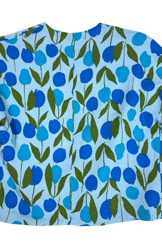 Vintage 1960s jacket in light blue cotton slub with a large tulip print. Features three-quarter length kimono-style sleeves, and an open front. Long darts from the bust to the waist provide shape through the torso. 

The lightweight jacket is lined in coordinating light blue rayon, which peeks through at the collar.