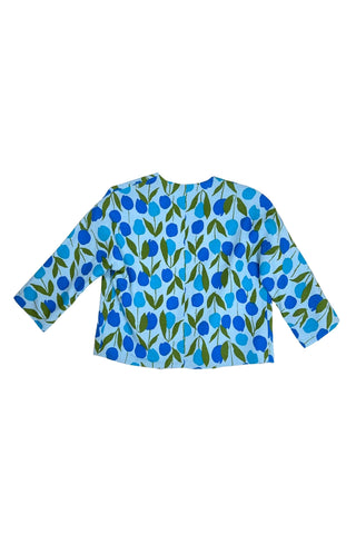 Vintage 1960s jacket in light blue cotton slub with a large tulip print. Features three-quarter length kimono-style sleeves, and an open front. Long darts from the bust to the waist provide shape through the torso. 

The lightweight jacket is lined in coordinating light blue rayon, which peeks through at the collar.