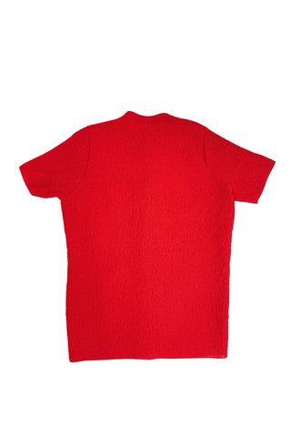 Vintage 1960s cardigan sweater in bright red ‘crazy’ textured knit (see closeup). The sweater features short sleeves with a round, ribbed collar, and a button placket with a zigzag pattern. The tight knit stitch gives the sweater a structured, weighty feel. The material feel like an acrylic blend.