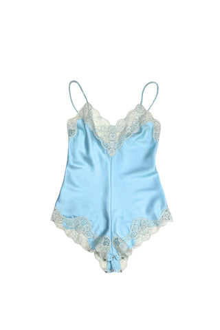 Vintage 1970s blue satin teddy one piece lingerie with snap closure by French Maid. Features beautiful wide white lace trim at the V neckline and around the legs, and matching blue satin spaghetti straps.

Designed by French Maid, Made in Canada. Marked Size 34.