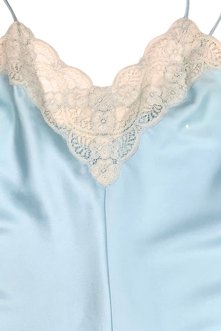 Vintage 1970s blue satin teddy one piece lingerie with snap closure by French Maid. Features beautiful wide white lace trim at the V neckline and around the legs, and matching blue satin spaghetti straps.

Designed by French Maid, Made in Canada. Marked Size 34.