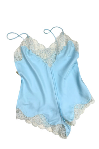 Vintage 1970s blue satin teddy one piece lingerie with snap closure by French Maid. Features beautiful wide white lace trim at the V neckline and around the legs, and matching blue satin spaghetti straps.

Designed by French Maid, Made in Canada. Marked Size 34.