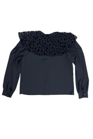 Vintage 1980s sheer black blouse with a chiffon collar featuring velvet polkadots and dots of silver sparkles. The blouse closes with four black buttons with rhinestone centres. The cuffs have matching button closures. The blouse comes with a separate tie piece that can be tied around the neck, or left off for a different look.