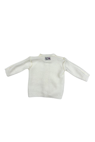 Vintage 1960s white baby sweater made of “Pure Orlon”. The bodice has a small square pattern with a slightly raised texture. The cardigan sweater closes with four pearly cateye buttons. 

Made in Canada.
