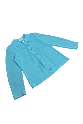 Vintage 1960s cardigan sweater in peacock blue Dacron polyester knit. The collar and button placket are accented with eyelet detailing. The cardigan closes with six pearly lucite buttons. 

The material is a medium weight polyester knit with a structured feel.

Designed by Kimberly.