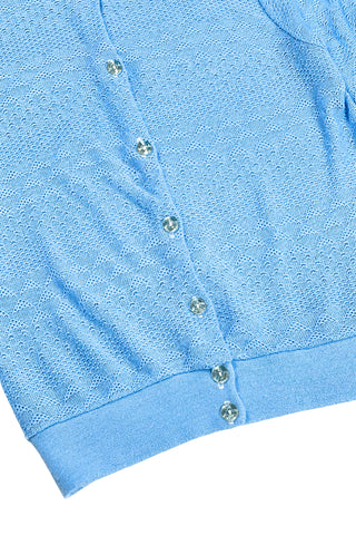 Vintage 1970s blue cardigan sweater with detailed eyelet knit in a variety of different stitches. Features a Peter Pan collar, clear plastic buttons, and ribbed sleeve cuffs and waistband, similar to a sweatshirt.

Designed by Excelsior Knitting Mills. Made in Canada.
