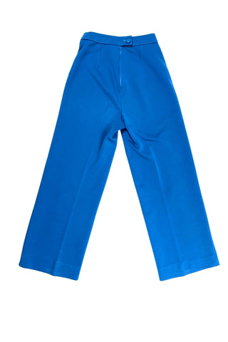 These vintage 1970s ladies’ trousers in peacock blue have the perfect true straight leg cut, providing an authentic 70s fit and flare shape when worn. The slight stretch of the medium-weight polyester fabric hugs your curves in all the right places. The trousers fasten in the back with a back zipper and self-fabric button closure. Unlined.