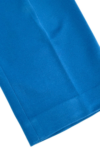 These vintage 1970s ladies’ trousers in peacock blue have the perfect true straight leg cut, providing an authentic 70s fit and flare shape when worn. The slight stretch of the medium-weight polyester fabric hugs your curves in all the right places. The trousers fasten in the back with a back zipper and self-fabric button closure. Unlined.