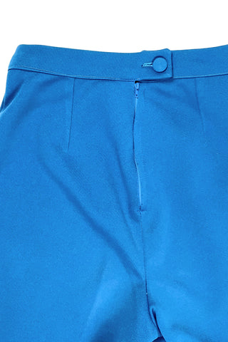 These vintage 1970s ladies’ trousers in peacock blue have the perfect true straight leg cut, providing an authentic 70s fit and flare shape when worn. The slight stretch of the medium-weight polyester fabric hugs your curves in all the right places. The trousers fasten in the back with a back zipper and self-fabric button closure. Unlined.