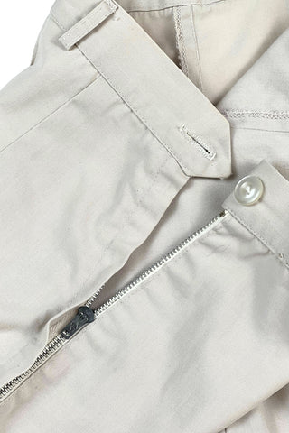 Vintage 1950s shorts in light beige cotton with front pin tuck sewn pleat accents and small belt loops. The shorts close in the side with a metal zipper and button closure and are unlined.

Designed with a high waist fit, with long and lean leg openings, hitting at the lower mid thigh.

Fashioned by Louben of Montreal. Made in Canada.