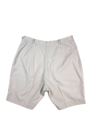 Vintage 1950s shorts in light beige cotton with front pin tuck sewn pleat accents and small belt loops. The shorts close in the side with a metal zipper and button closure and are unlined.

Designed with a high waist fit, with long and lean leg openings, hitting at the lower mid thigh.

Fashioned by Louben of Montreal. Made in Canada.