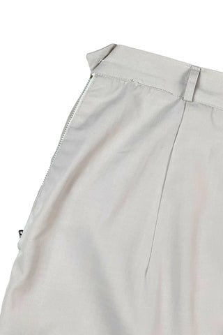 Vintage 1950s shorts in light beige cotton with front pin tuck sewn pleat accents and small belt loops. The shorts close in the side with a metal zipper and button closure and are unlined.

Designed with a high waist fit, with long and lean leg openings, hitting at the lower mid thigh.

Fashioned by Louben of Montreal. Made in Canada.