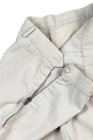 Vintage 1950s shorts in light beige cotton with front pin tuck sewn pleat accents and small belt loops. The shorts close in the side with a metal zipper and button closure and are unlined.

Designed with a high waist fit, with long and lean leg openings, hitting at the lower mid thigh.

Fashioned by Louben of Montreal. Made in Canada.