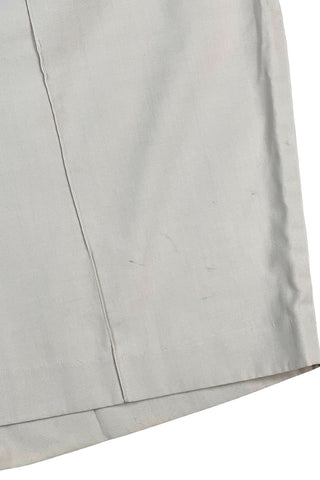Vintage 1950s shorts in light beige cotton with front pin tuck sewn pleat accents and small belt loops. The shorts close in the side with a metal zipper and button closure and are unlined.

Designed with a high waist fit, with long and lean leg openings, hitting at the lower mid thigh.

Fashioned by Louben of Montreal. Made in Canada.