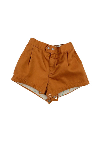 Vintage 1950s baby shorts in caramel brown cotton, with metal zipper fly and two button waist closure. The leg openings are faced with white yellow and green striped twill tape. The bottom of the shorts has a metal snap closure.

The perfect short for your tiniest camper this summer!
