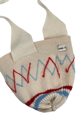 Vintage 1960s wool baby hat with ear flaps and chin tie. Features a folded, striped brim around the head, and a pompom on top.

The only label reads Made in Canada.