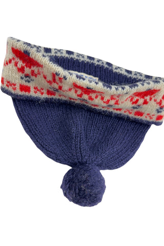 Vintage 1950s children’s wool hat featuring the Swedish “old man” pattern known as gubbamönster. The hat has a wide folded brim and a small pompom on top.