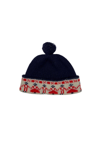 Vintage 1950s children’s wool hat featuring the Swedish “old man” pattern known as gubbamönster. The hat has a wide folded brim and a small pompom on top.