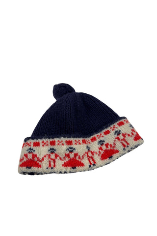 Vintage 1950s children’s wool hat featuring the Swedish “old man” pattern known as gubbamönster. The hat has a wide folded brim and a small pompom on top.