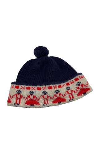 Vintage 1950s children’s wool hat featuring the Swedish “old man” pattern known as gubbamönster. The hat has a wide folded brim and a small pompom on top.