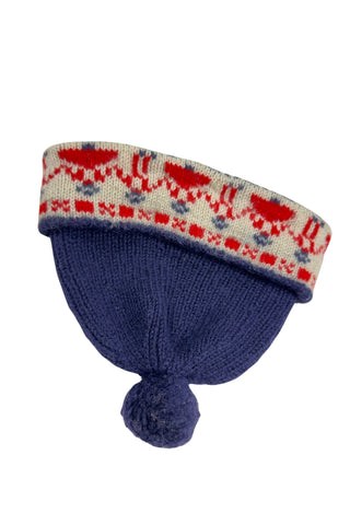 Vintage 1950s children’s wool hat featuring the Swedish “old man” pattern known as gubbamönster. The hat has a wide folded brim and a small pompom on top.